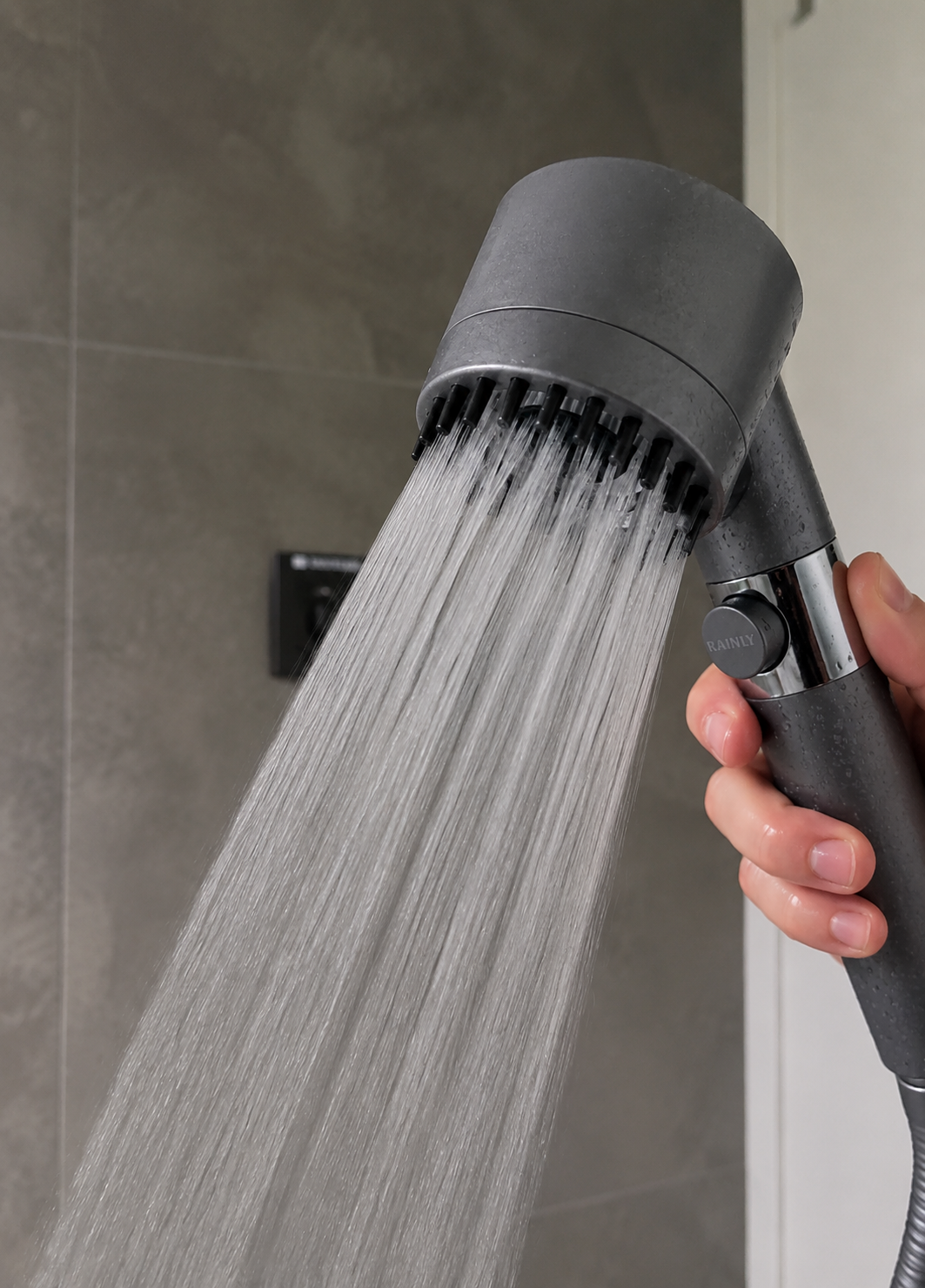 RAINLY shower head in Rain mode with a soft rainfall pattern